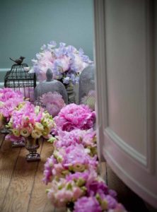 Vases with peonies and roses ready to be disposed