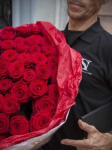 A delivery man and his bouquet