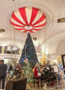 The hall of the Hôtel de Paris in Monaco will all the Christmas Trees