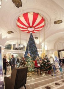 The hall of the Hôtel de Paris in Monaco will all the Christmas Trees