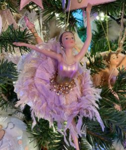 A ballerina dancing on a tree