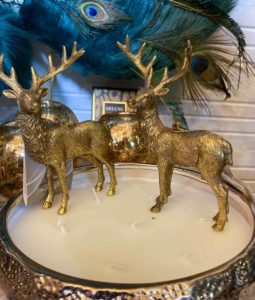 Golden deer on a large candle